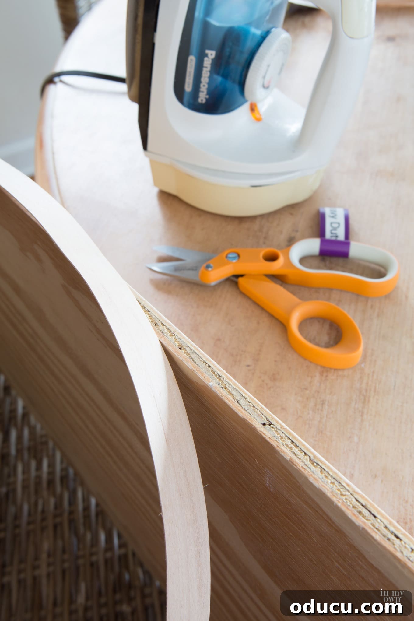 Transforming a Sideboard into a Bathroom Vanity 20 Sanding plywood edge before applying veneer for a smooth finish