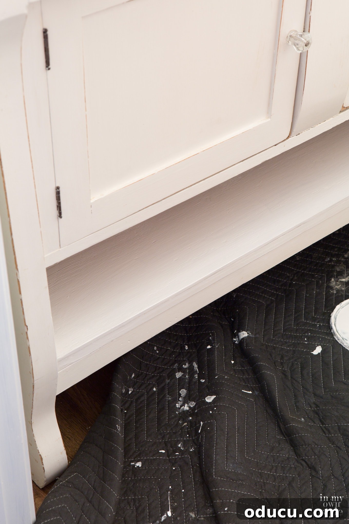 Transforming a Sideboard into a Bathroom Vanity 24 Plywood shelf installed with Liquid Nails, awaiting paint