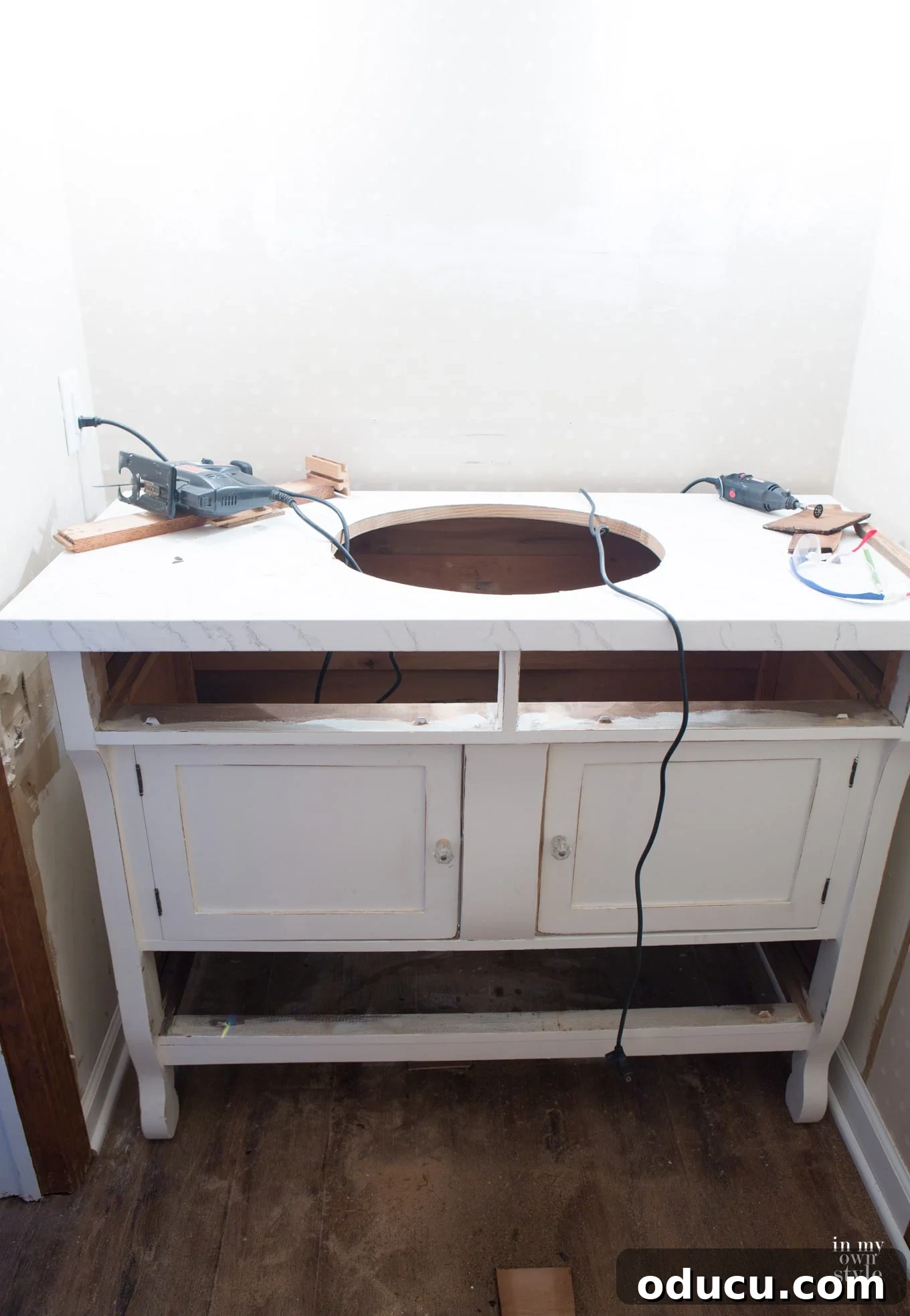 Transforming a Sideboard into a Bathroom Vanity 8 Using a jigsaw to cut the sink opening in the repurposed vanity top