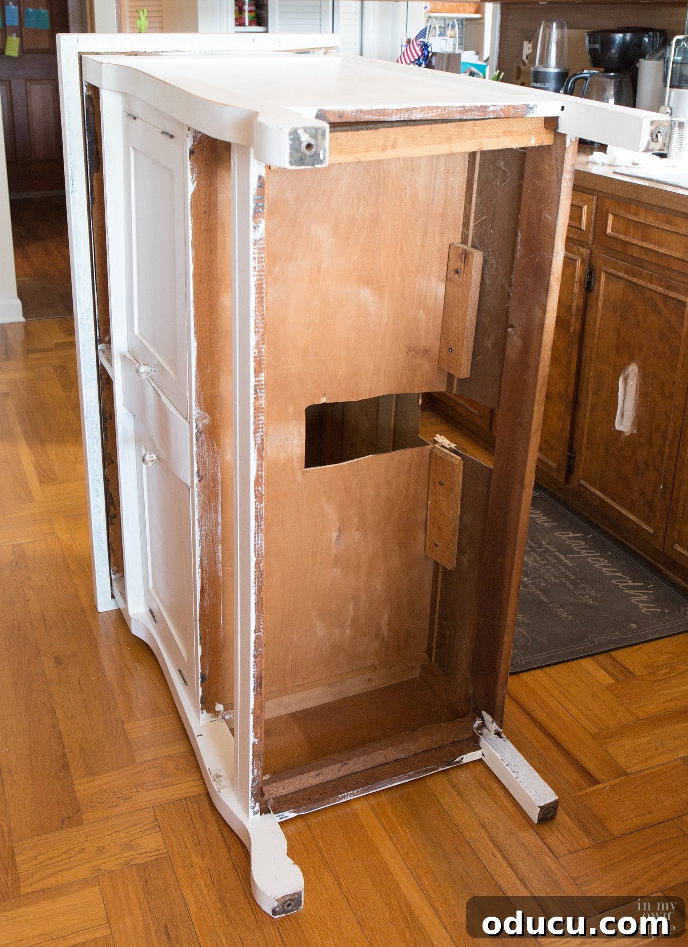 Transforming a Sideboard into a Bathroom Vanity 10 Cutting out space for wall plumbing pipes at the back of the sideboard