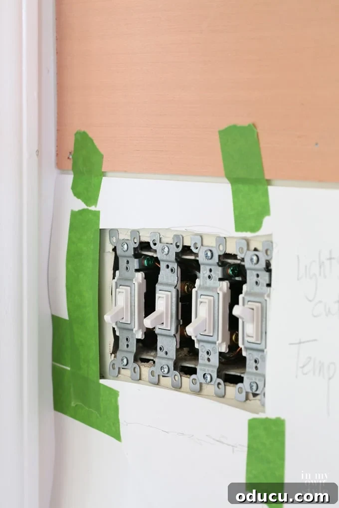 Effortless Shiplap Wood Wall Installation 13 How to cut out outlets and switch plates when installing a wood plank or ship lap wall