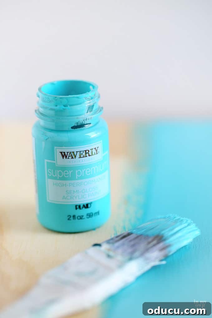 Waverly inspirations craft paint used to paint a storage crate seat underside in Lagoon