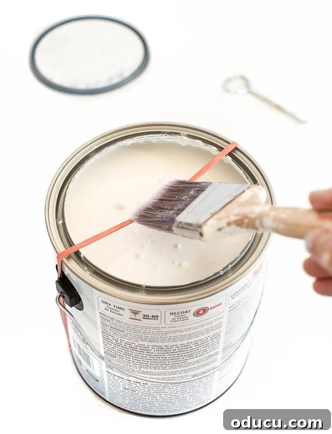 Effortless Paint Cleanup Hacks 5 Paint clean up tips. How to dip a paint into a can of paint.