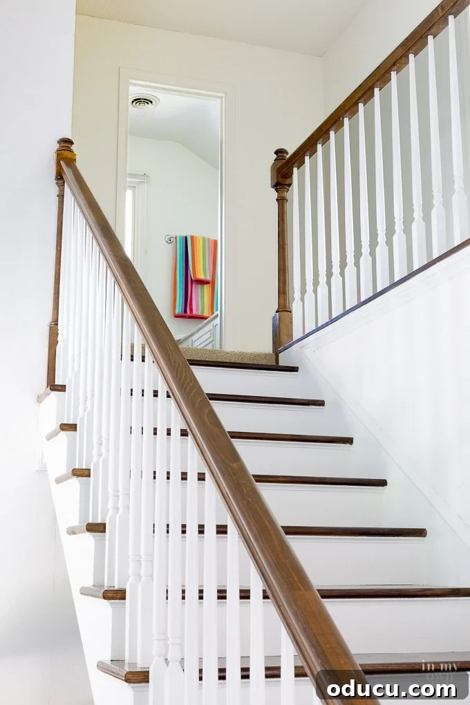 Revamp Your Stairs: Flawless Spindle Painting Made Simple 4 Staircase makeover showing how to remove carpet and paint risers and stain steps for a clean modern look