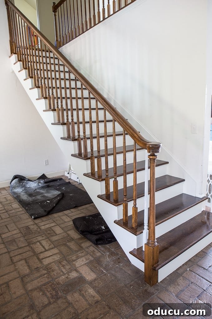 Revamp Your Stairs: Flawless Spindle Painting Made Simple 5 White painted riser staircase