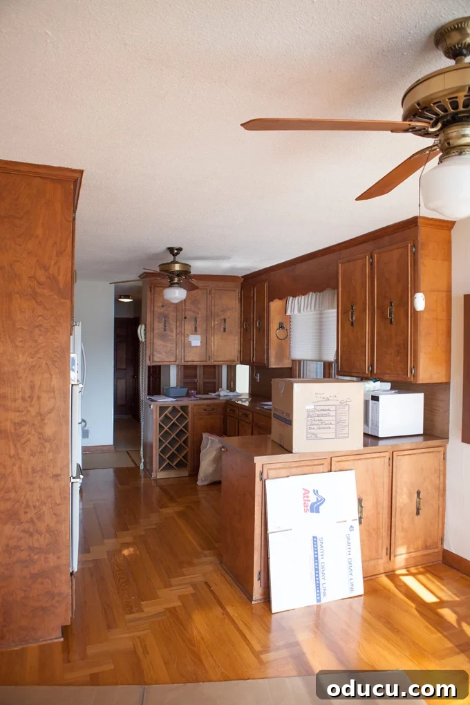 Kitchen Transformation: Farewell to the Funk 2 Before DIY kitchen makeover of a 1970s kitchen with brown cabinets and dated features