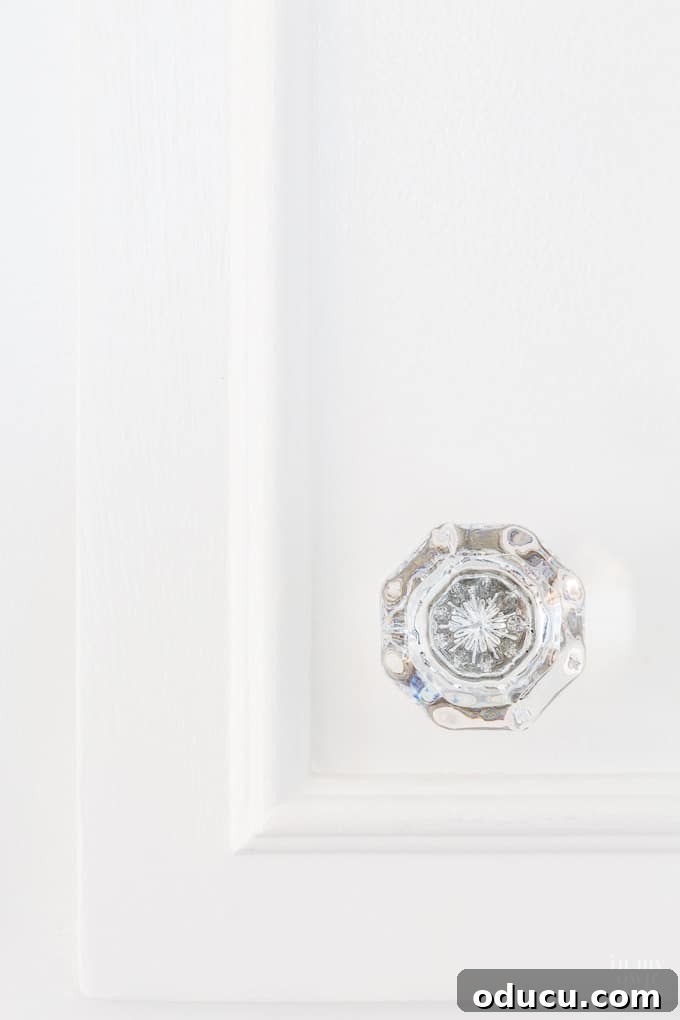Close-up of a beautifully designed cut glass kitchen cabinet knob, showcasing its intricate pattern.
