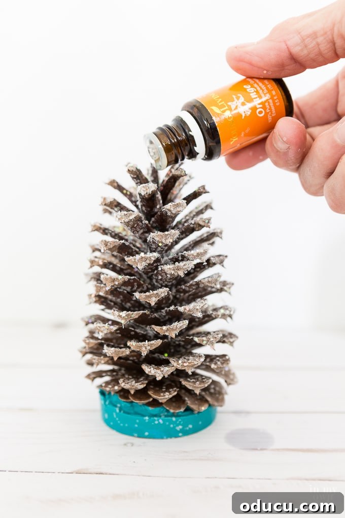 Vibrant Fragrant Holiday Pinecone Creations 14 Finished essential oil scented pine cone trees, displaying vibrant colors and ready for gifting or home decoration.