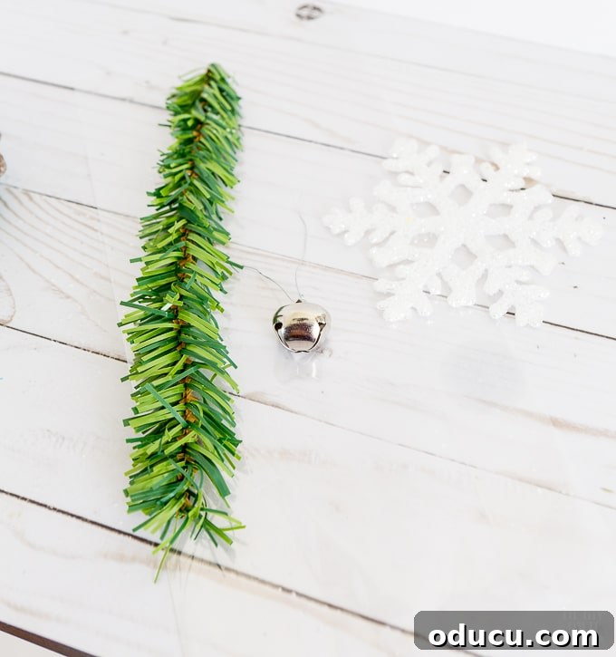 Vibrant Fragrant Holiday Pinecone Creations 15 Collection of gift wrapping supplies for small handmade pine cone gifts, including clear bags, snowflake ornaments, and garland ties.