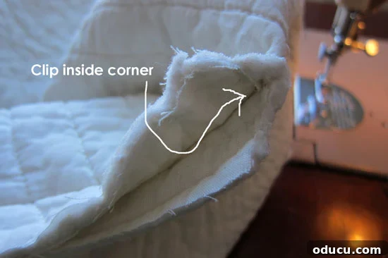 Quilt-slipcover-tutorial-11 Clipping corners of the fabric for a flat finish