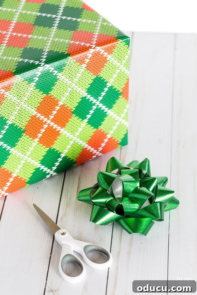 Creative and easy gift wrapping ideas for Christmas with a styled confetti bow before transformation