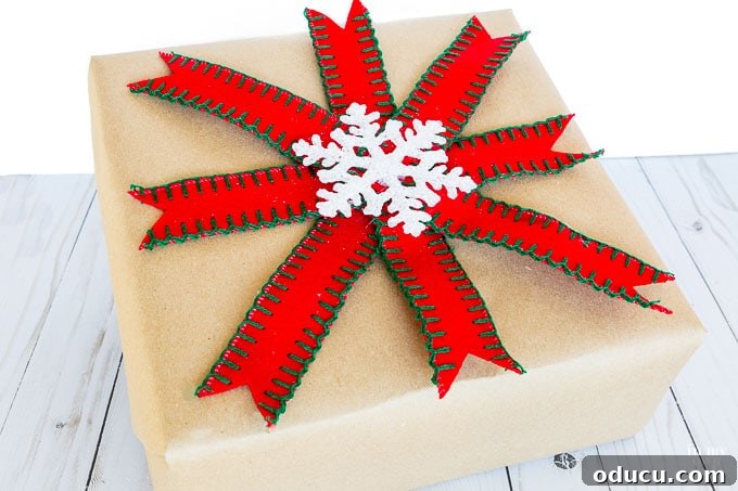 Make your own gift wrap embellishment with ribbon and a central decorative element