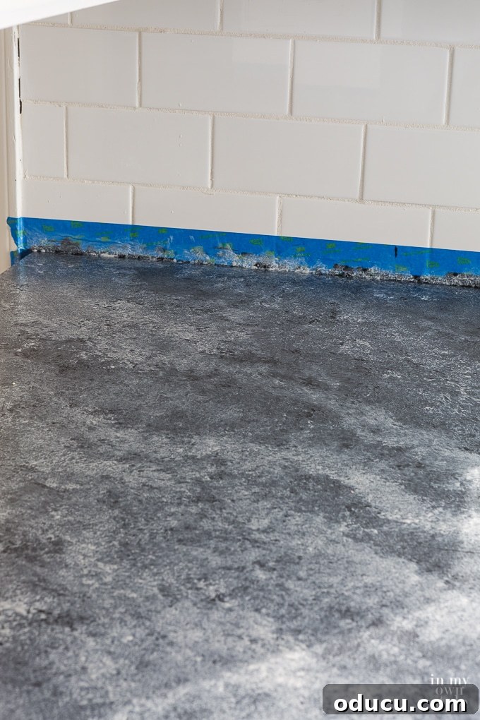 Kitchen Remodel: The Home Stretch 9 Kitchen countertop after applying Giani paint primer and two layers, showing initial transformation