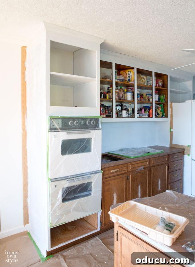 Lake House Living A DIY First Year 40 Kitchen makeover progress showcasing tips on how to paint kitchen cabinets
