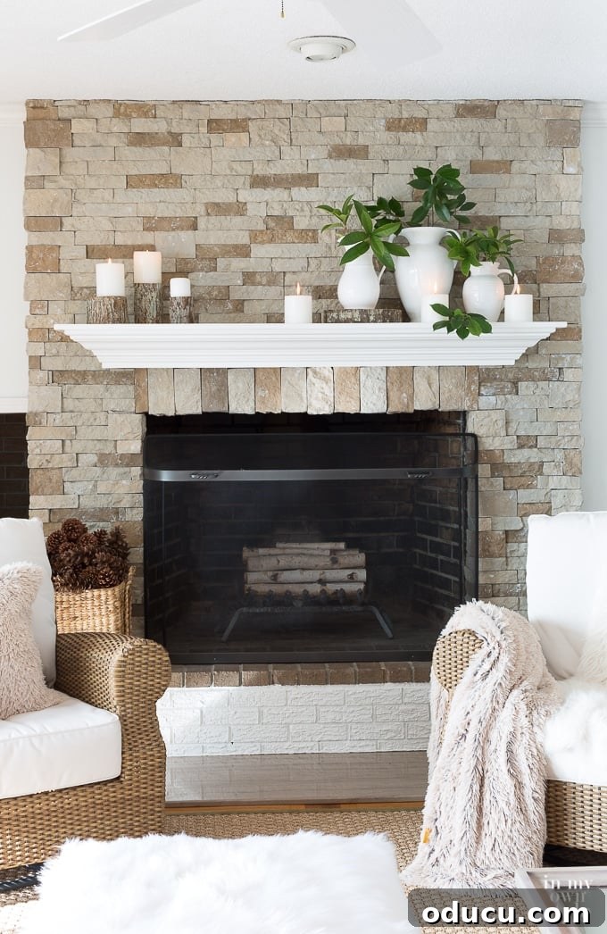 Cozy Winter Interiors: Cultivate Calm and Rejuvenation 11 Warm and inviting living room with a decorated mantel and glowing candles