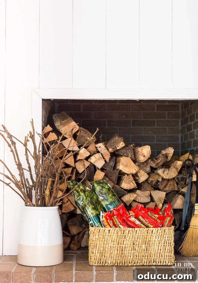 Cozy Winter Interiors: Cultivate Calm and Rejuvenation 15 Organized fireplace logs and kindling creating a cozy winter atmosphere