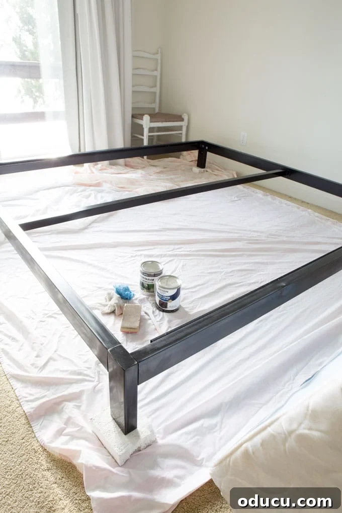 Easy DIY Headboard for Your Guest Space 11 Step-by-step guide on how to paint a metal bed frame, showing the finished look