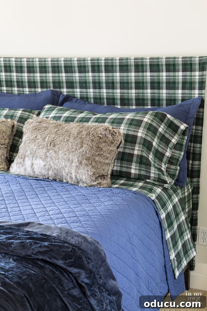 Easy DIY Headboard for Your Guest Space 8 Draping a flat sheet over a curtain rod for a DIY headboard, showing the soft folds