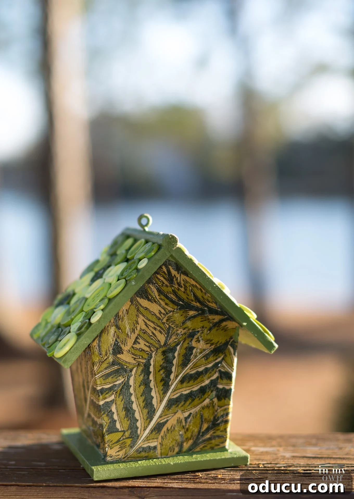 Elevate Your Birdhouse Decor 16 Back View of a Hand-Decorated Birdhouse with Fabric and Buttons