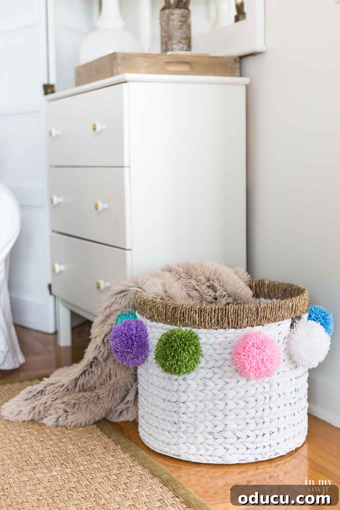My Signature Pom Pom Basket 15 Variety of colorful pom poms on a basket