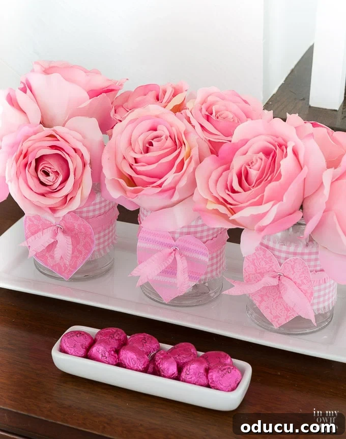 Valentine's Day Triple Vase Tray 3 Close-up of a decorated white sideboard with Valentine's Day decor