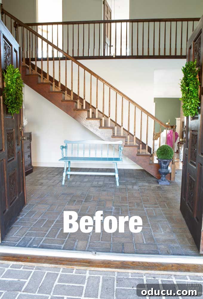 Transform Your Staircase into a Secret Storage Haven 2 Foyer staircase before adding hidden door underneath for storage, showcasing the unused space.