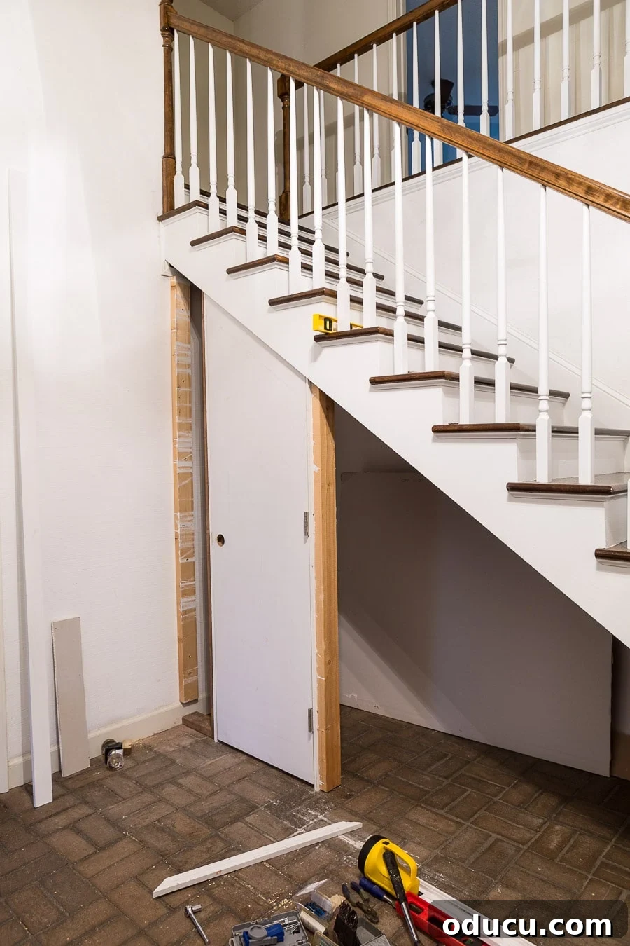 Transform Your Staircase into a Secret Storage Haven 15 How to create a closet under a staircase, illustrating the door's structure after the angled cut.
