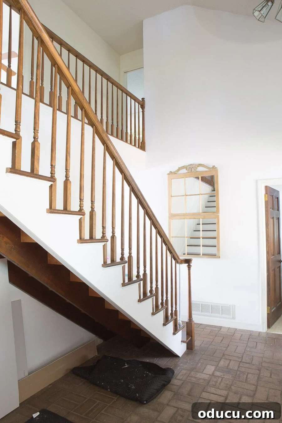 Transform Your Staircase into a Secret Storage Haven 3 How to add a hidden closet under an open staircase, demonstrating the vast empty space.