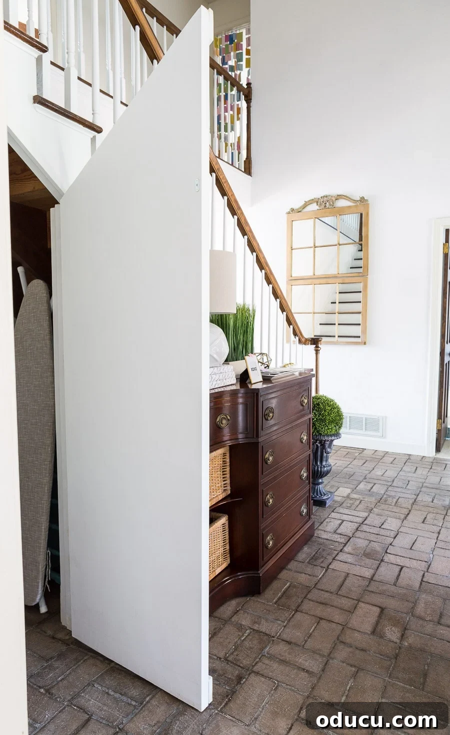 Transform Your Staircase into a Secret Storage Haven 27 Angled hidden door under staircase closet, showing the interior of the door with the metal plate.