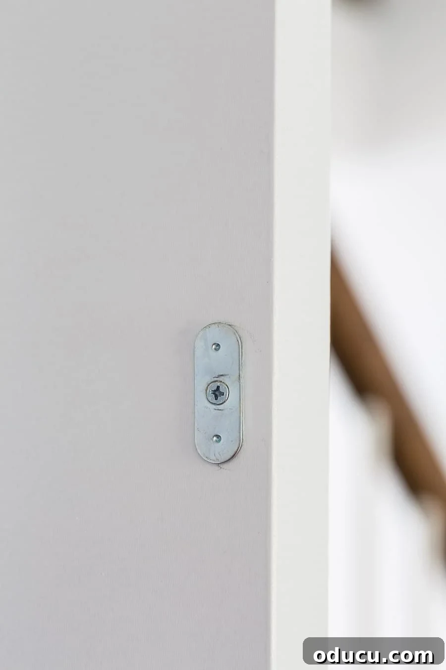 Transform Your Staircase into a Secret Storage Haven 28 Magnetic latch for hidden door, showing the interaction between the latch and the metal plate.