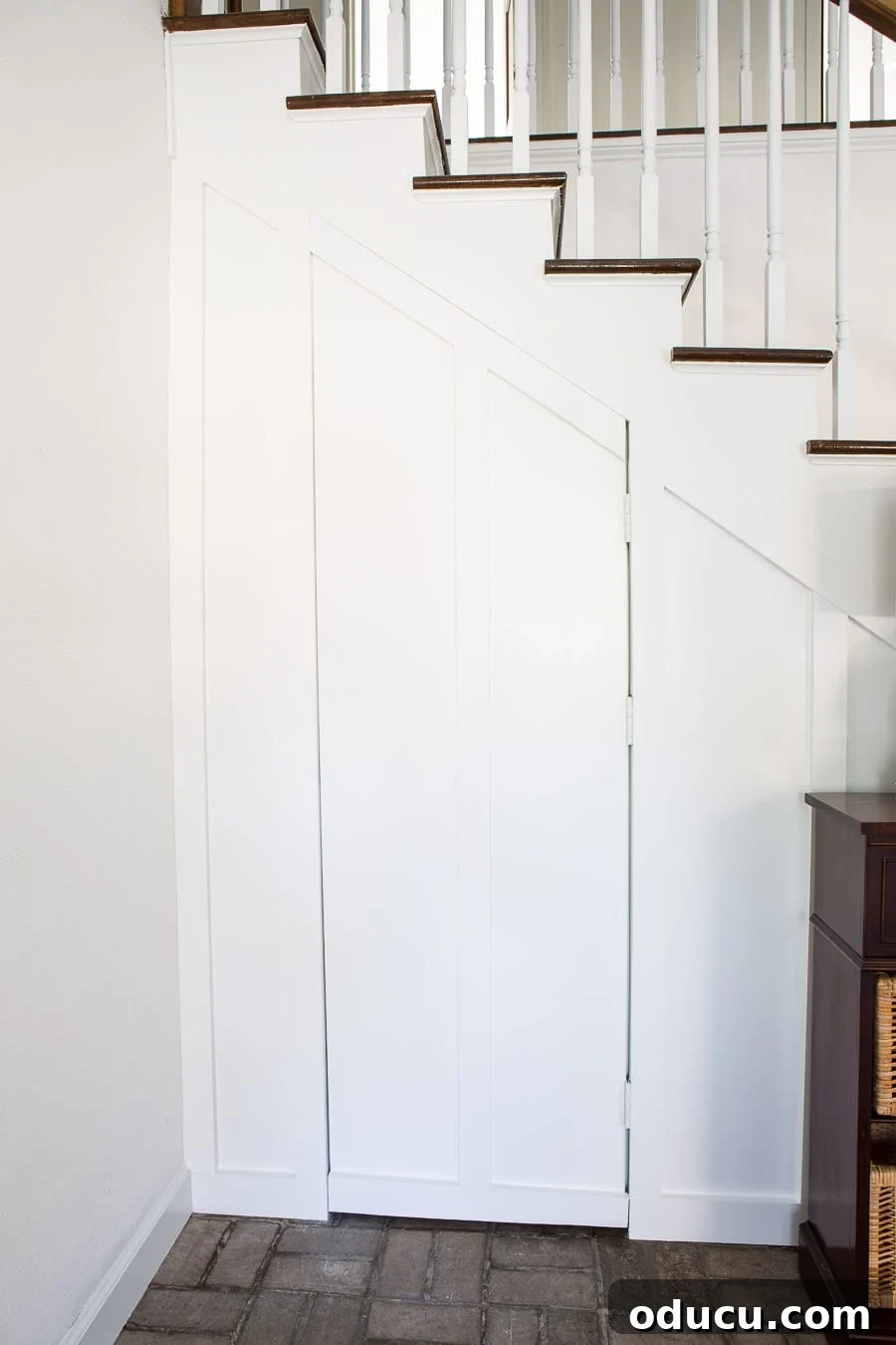 Transform Your Staircase into a Secret Storage Haven 29 Semi-hidden door for a board and batten wall, showcasing the hinges used.