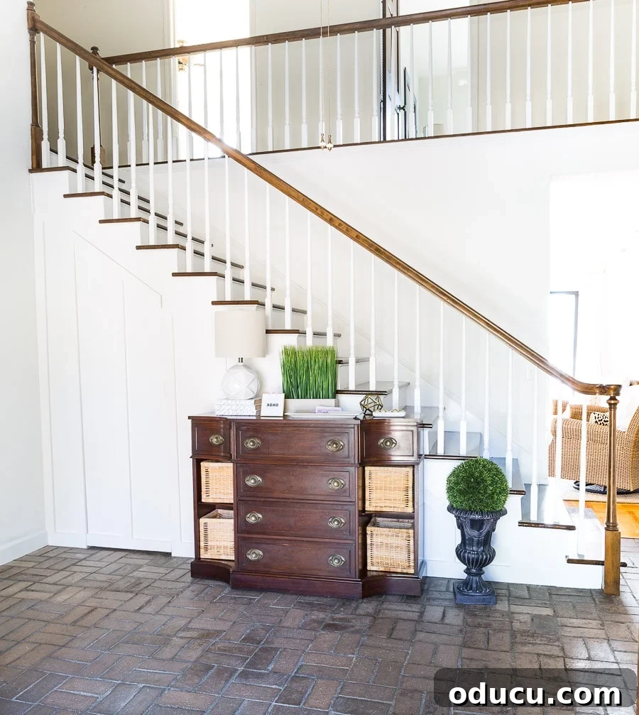 Transform Your Staircase into a Secret Storage Haven 7 DIY Hidden door and closet under staircase, showcasing the finished board and batten wall.