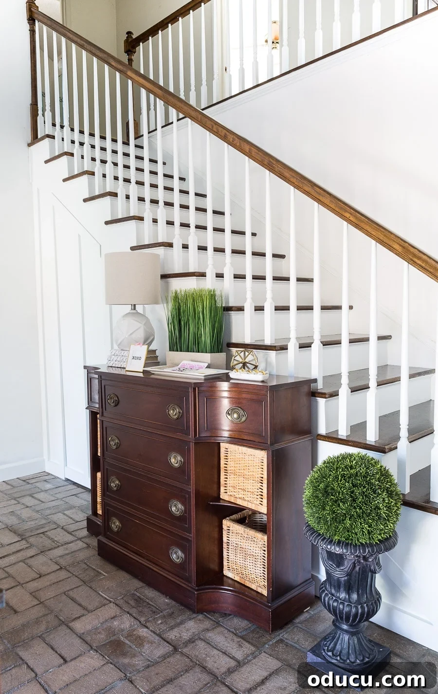 Transform Your Staircase into a Secret Storage Haven 8 Hidden door under staircase for extra storage, showing the door's seamless integration into the wall.