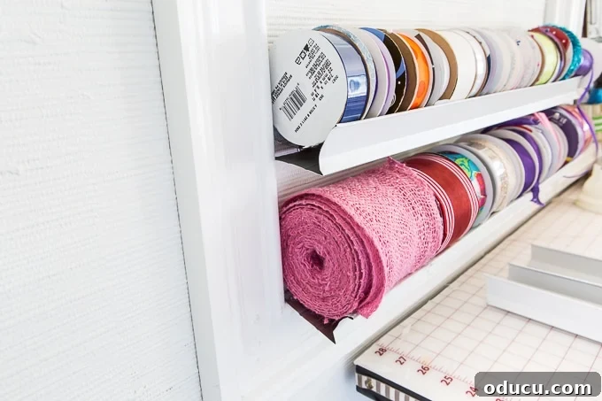 Conquer Ribbon Chaos: Genius Storage for Every Spool 12 Angled display of ribbon spools on the wall organizer