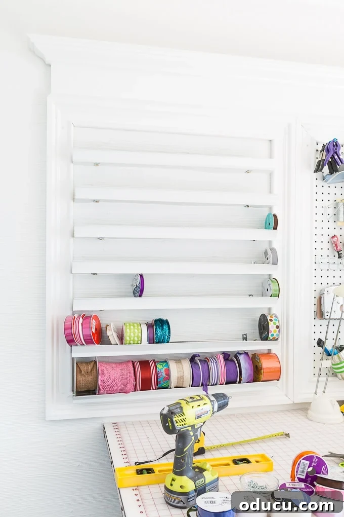 Conquer Ribbon Chaos: Genius Storage for Every Spool 13 Arranging ribbon spools by size on the DIY organizer