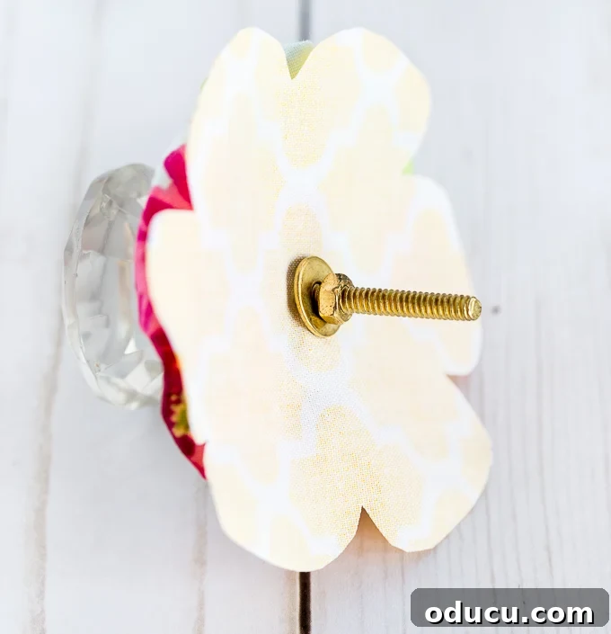 Revitalize Furniture with Fabric and Liquid Starch 27 DIY drawer pull idea: Attaching the fabric flower knob to the drawer.