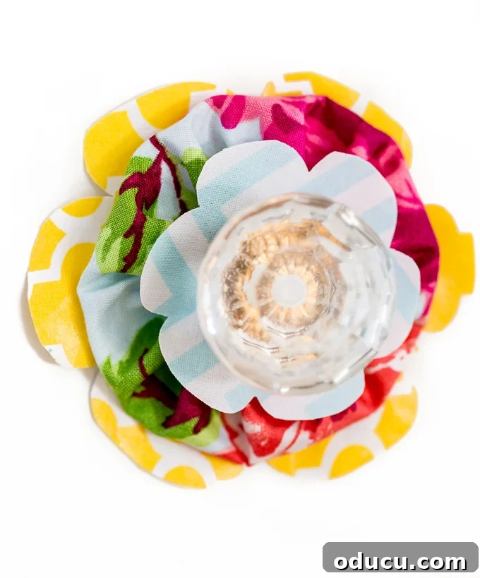 Revitalize Furniture with Fabric and Liquid Starch 28 Flower drawer pulls or knobs to make: Variety of fabric flower knobs with different patterns.