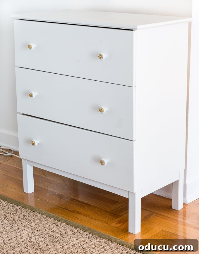 Revitalize Furniture with Fabric and Liquid Starch 4 Before and After Furniture Makeover Using Fabric + Liquid Starch: Plain white dresser transformed into a vibrant piece.