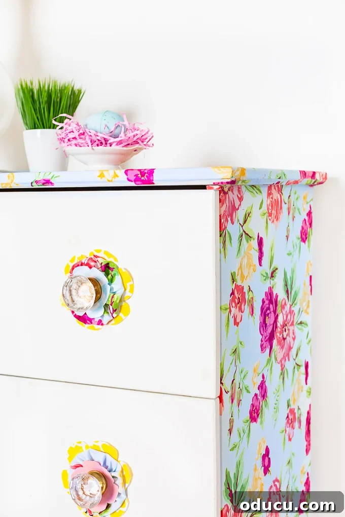 Revitalize Furniture with Fabric and Liquid Starch 6 Colorful Furniture Makeover Using Fabric + Liquid Starch: Close-up of the finished dresser with patterned fabric.