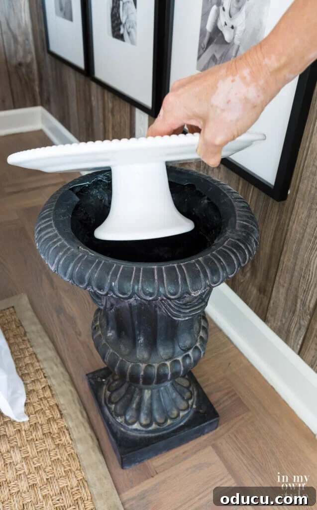 Transform an Old Urn into a Chic Side Table 5 Creative upcycled end table idea, showcasing a classic garden urn repurposed with a top surface.