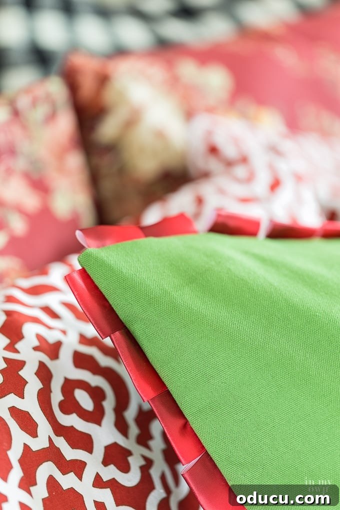 Elevate Your Bathroom With Towel Decor 22 A visual guide on how to utilize ribbon to craft beautiful decorative trim for a pillow, demonstrating a cost-effective DIY technique.