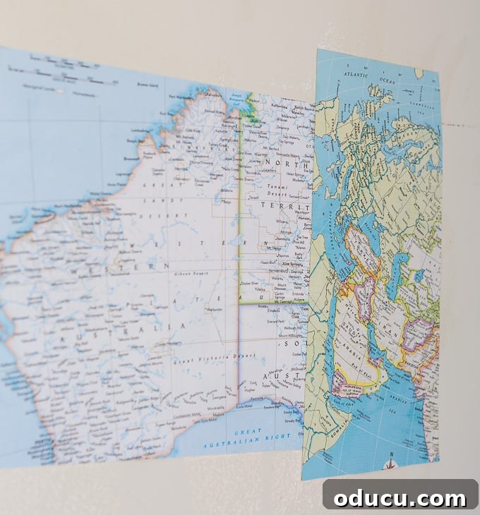 Globetrotting Laundry Room: DIY Map Wallpaper Project 21 DIY map wallpaper step by step tutorial that shows how to remove wrinkles that may appear when applying maps and or paper to walls