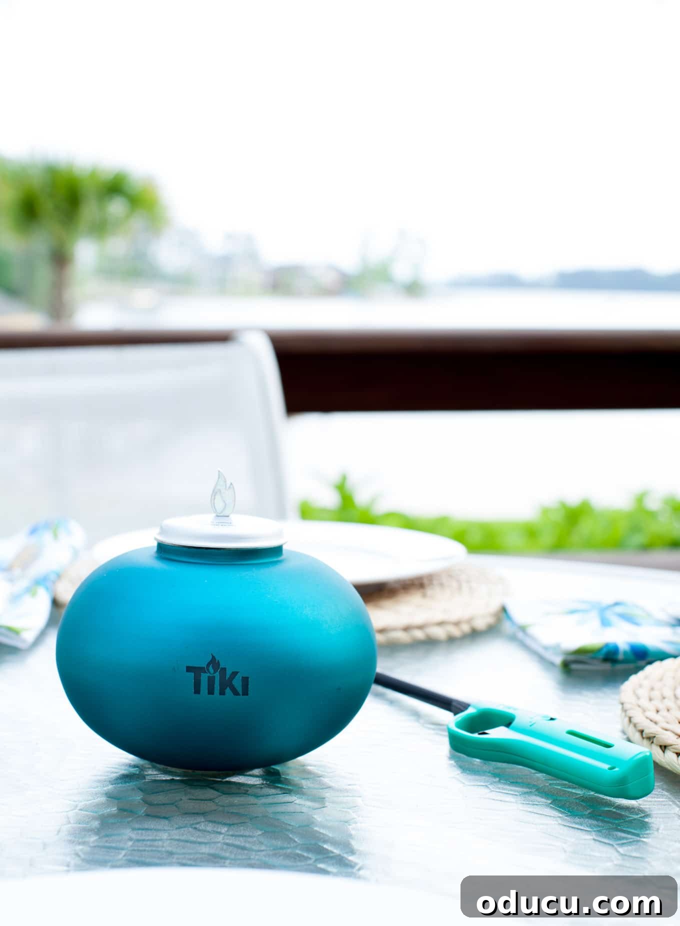 My Lakeside Haven 4 Elegant TIKI Brand Clean Burn Tabletop Firepiece in Teal, adding ambiance to an outdoor table without smoke or soot, perfect for stylish outdoor entertaining.