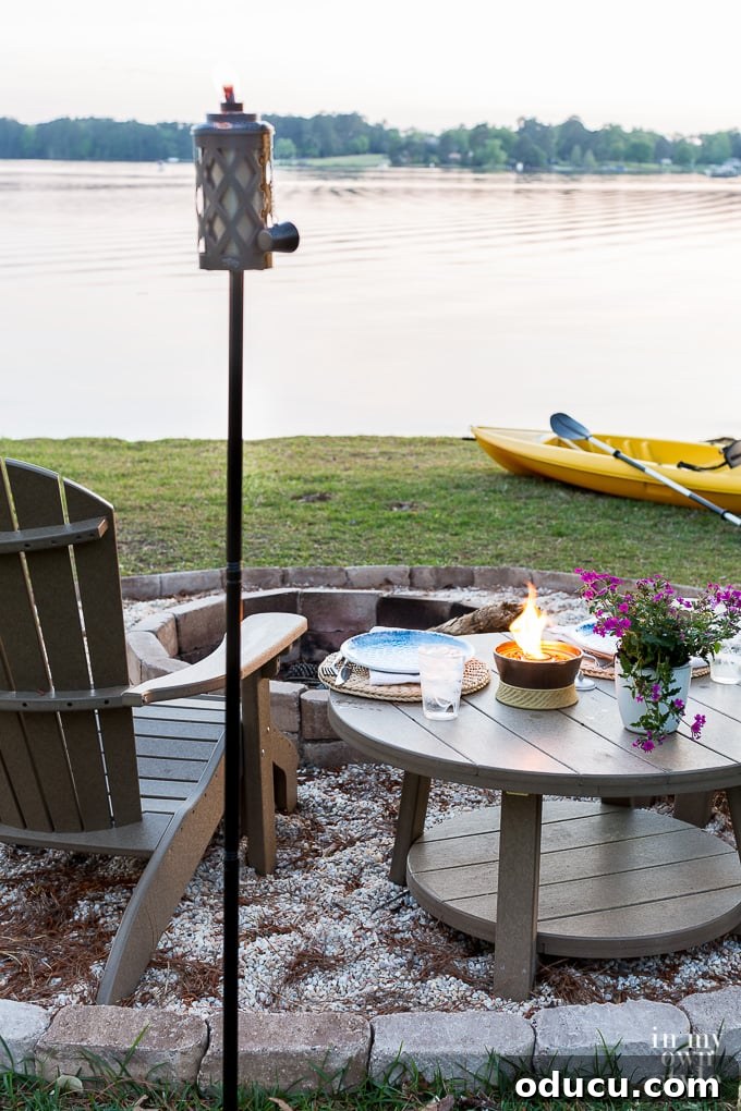 My Lakeside Haven 5 Modern Urban Metal Torch by TIKI, providing ambient lighting for outdoor spaces.
