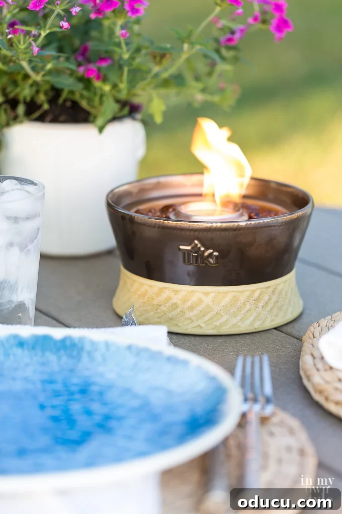My Lakeside Haven 6 Enhance your outdoor dining table with a TIKI Brand Tabletop Firepiece, featuring the Clean Burn system for beautiful ambiance without smoke. Available in various styles.