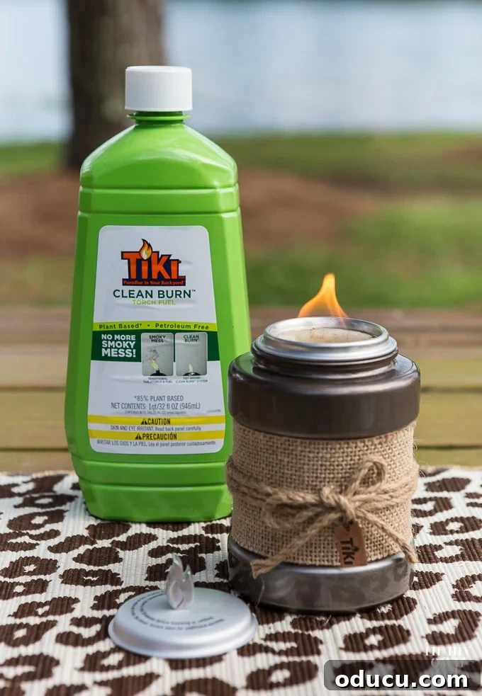 Your Secret Weapon for Stellar Outdoor Parties 11 TIKI Brand Clean Burn Fuel and Tabletop firepiece, offering a superior and sustainable lighting experience.