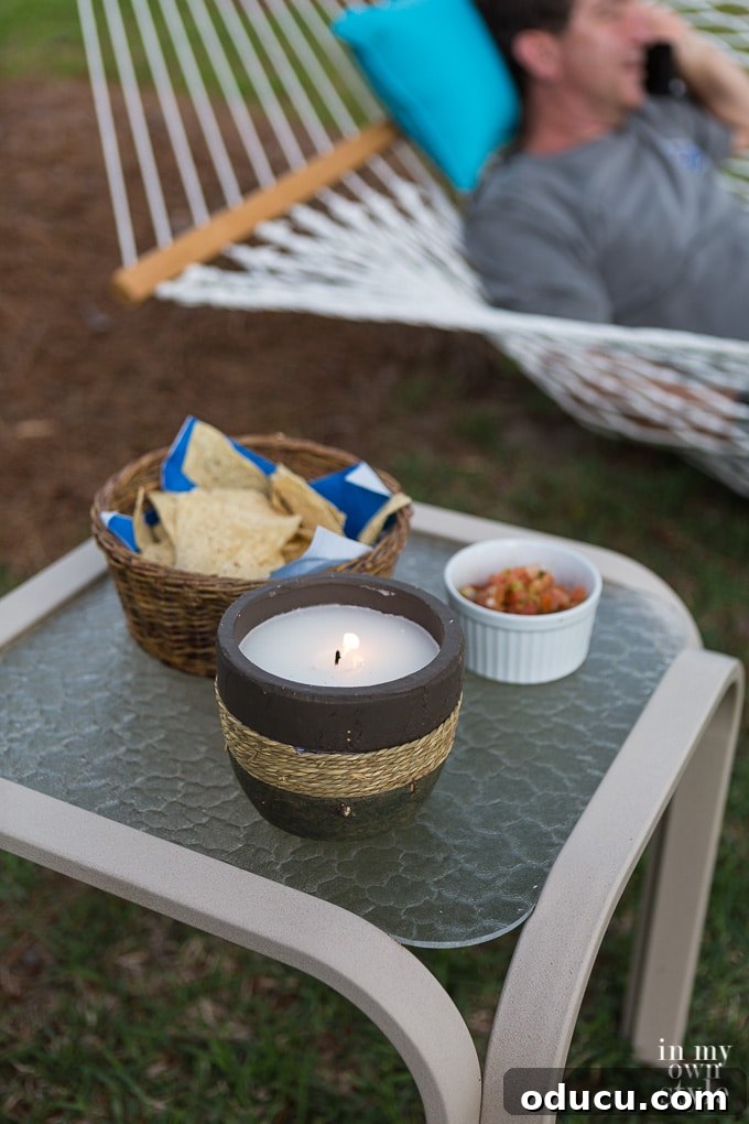 Your Secret Weapon for Stellar Outdoor Parties 13 TIKI Citronella Candles for outdoor entertaining, providing both light and insect repellent properties.