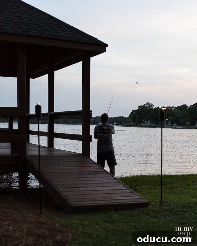 Your Secret Weapon for Stellar Outdoor Parties 15 Fishing at night, illuminated by soft outdoor lighting, creating a peaceful and unique evening activity.