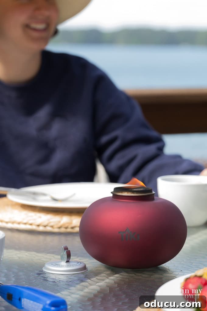 Your Secret Weapon for Stellar Outdoor Parties 3 Tiki Red Glass Tabletop Firepiece for elegant dining al fresco, enhancing the outdoor dining experience.