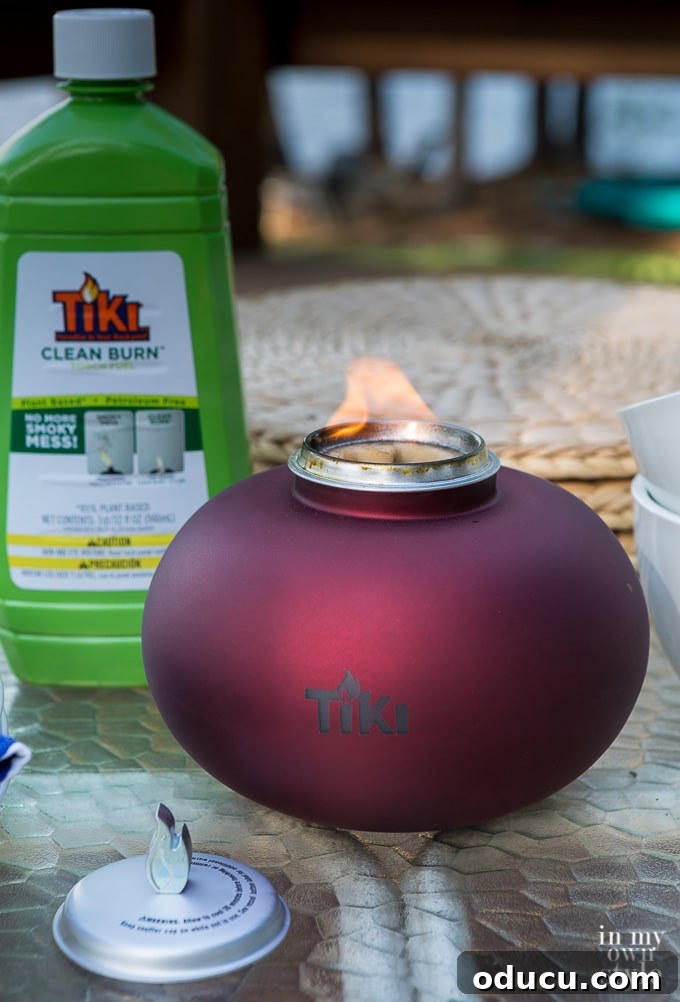 Your Secret Weapon for Stellar Outdoor Parties 9 TIKI Clean Burn Fuel and Tabletop Firepiece for a smoke-free and inviting outdoor experience.
